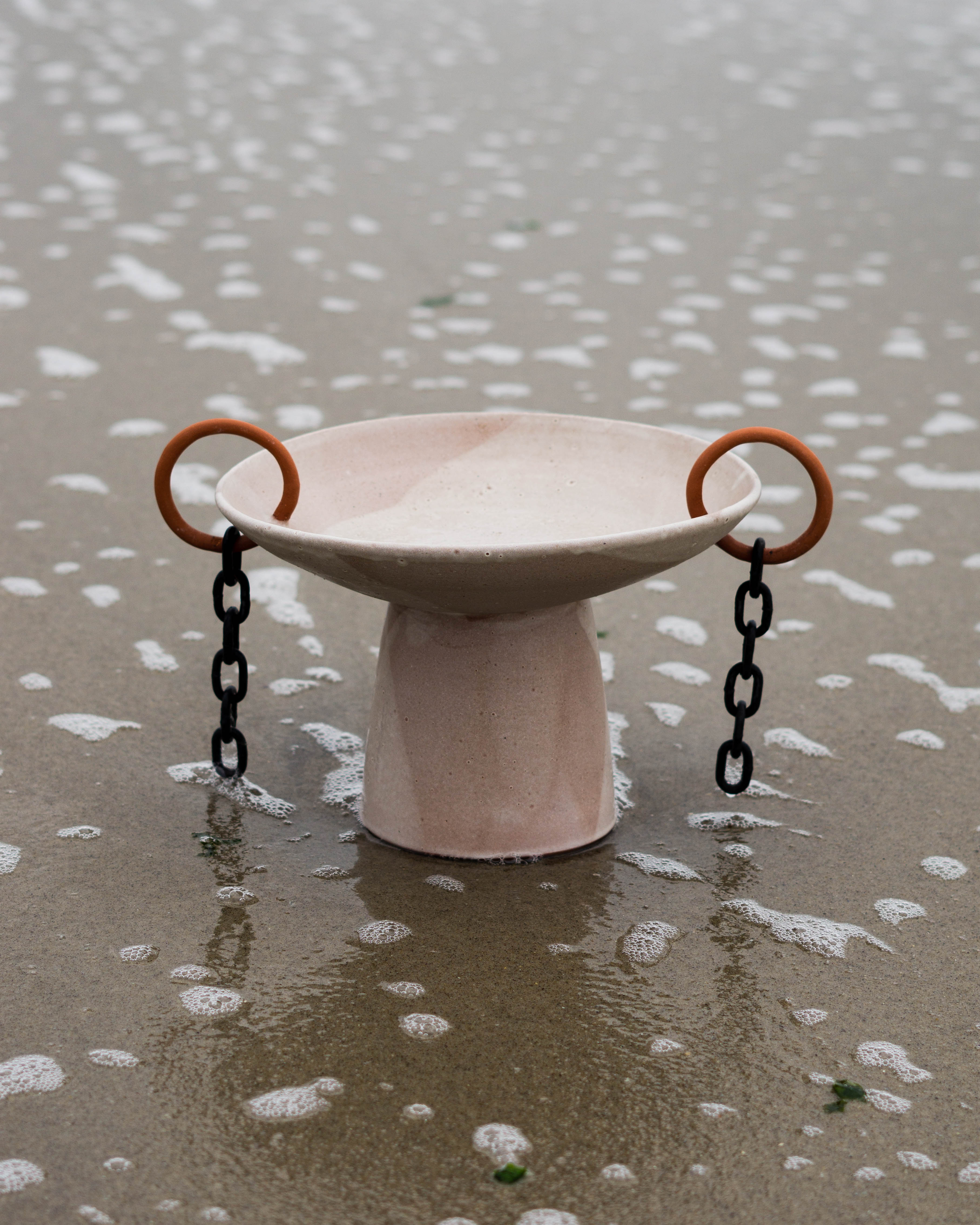 Pedestal bowl with chainlink detail shown in beach setting
